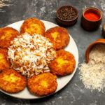 top-view-fried-cutlets-with-cooked-rice-seasonings-dark-surface-food-meat-dish