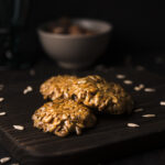 close-up-muesli-cookies-wooden-board